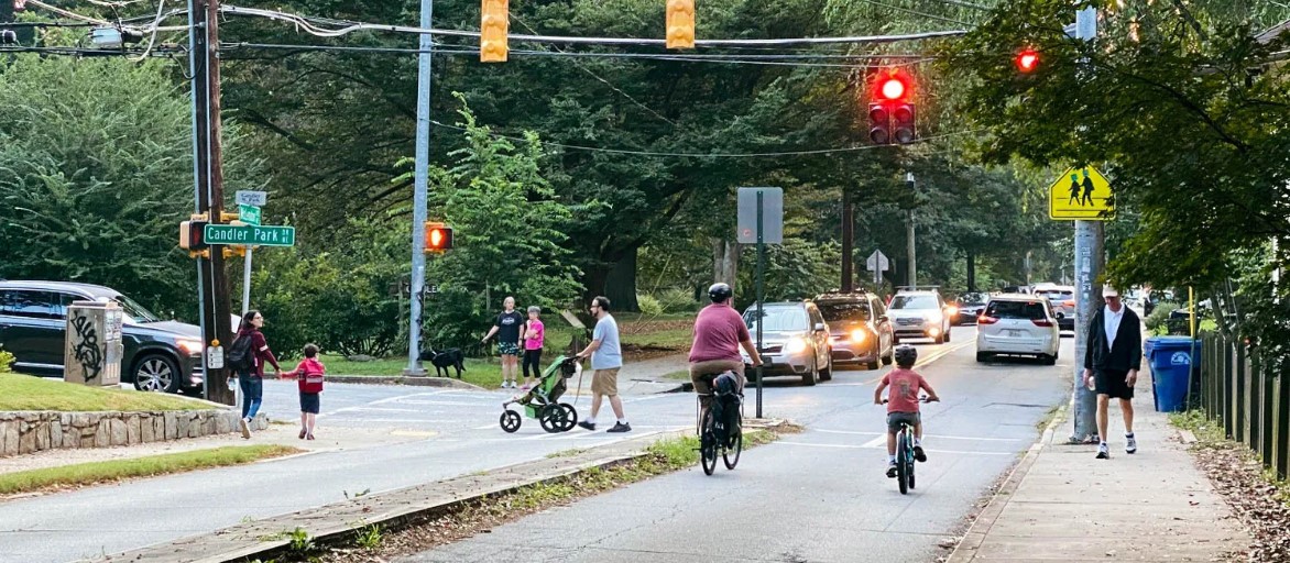 mclendon avenue with traffic, walkers, and bikes
